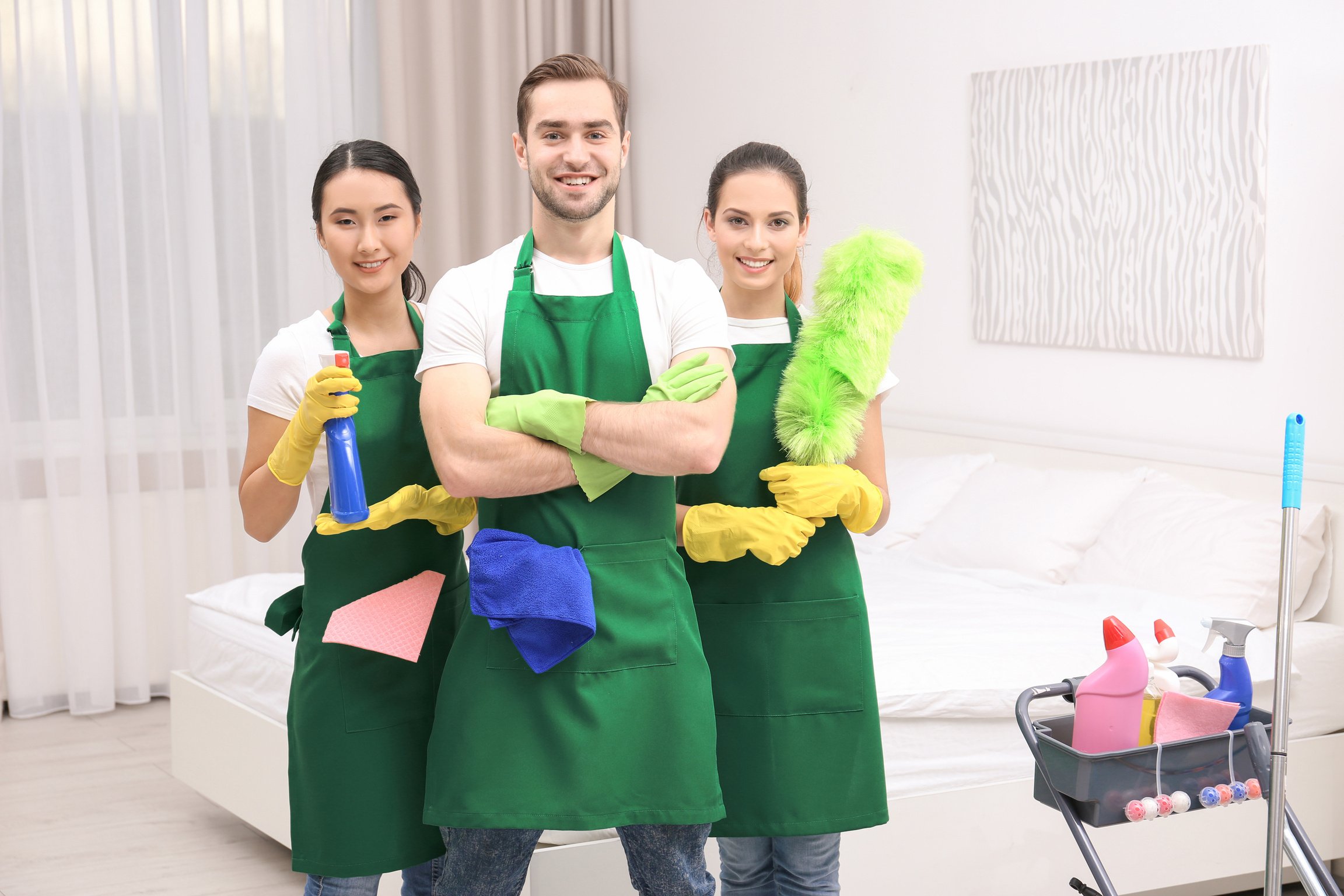 Cleaning Service Team at Work in Bedroom