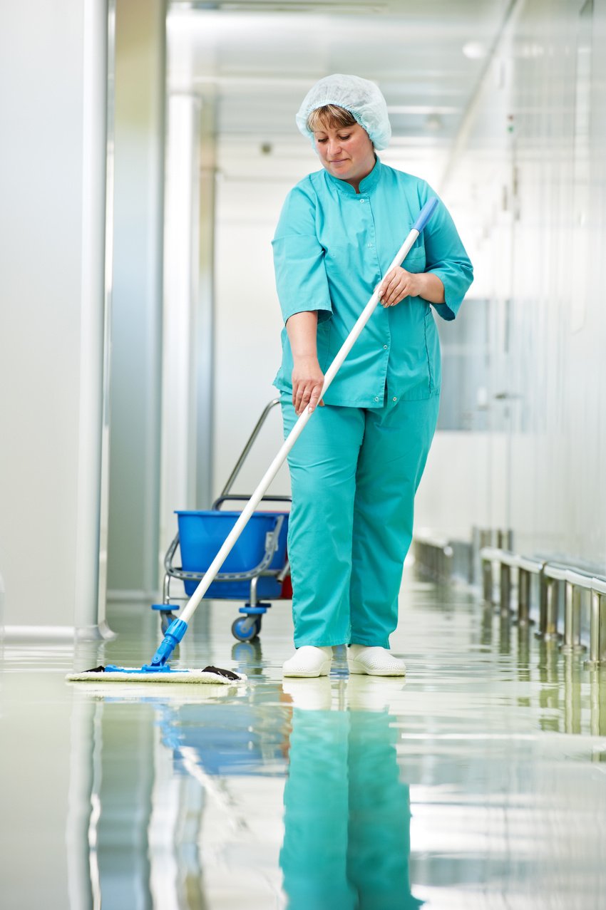 Woman cleaning hospital hall